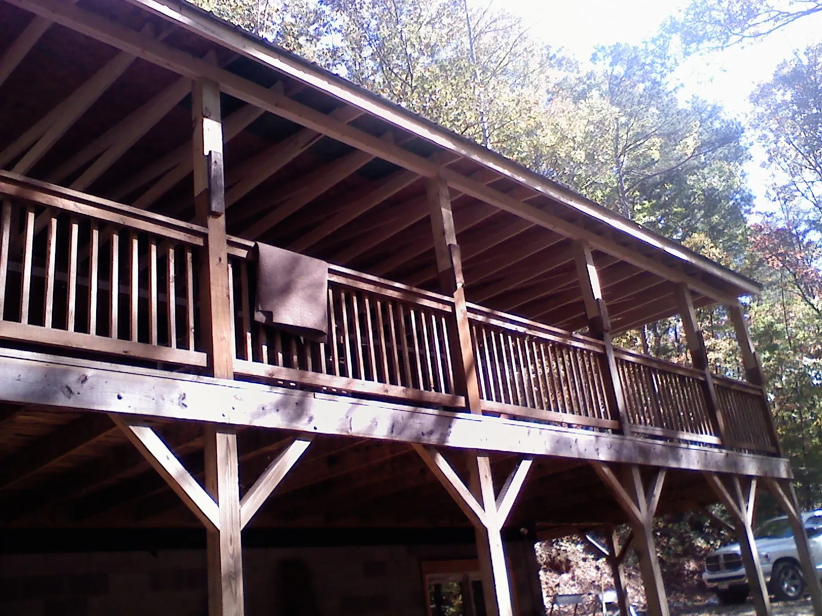 Timber framing under a new elevated porch and deck — Roof Leak Repair in Boothbay by Roofing Brothers